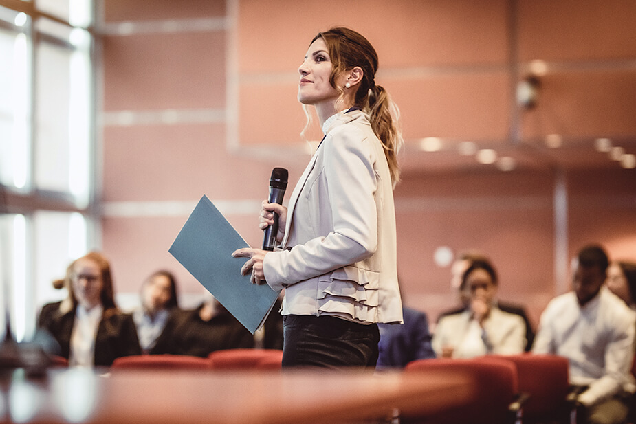 Woman confidently speaking to an audience